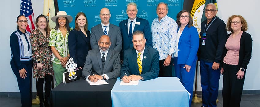 Hudson County College and Stockton staff during signing 