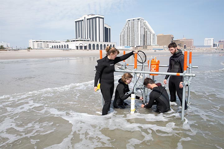 Coastal researchers on beach