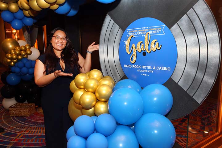 Nancy Ayala with a balloon column