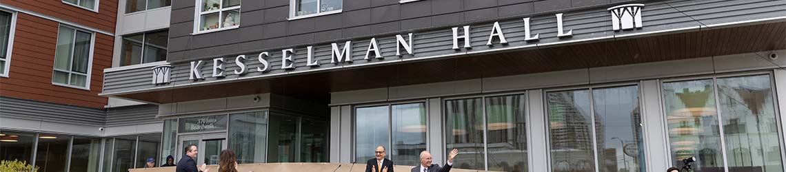 A closeup view of the name 'Kesselman Hall' on the outside of the Atlantic City residential building