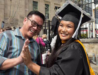 AtlantiCare OR Nurse Warren Flores congratulates his daughter, Charisse Flores, on receiving her nursing degree from Stockton University at the Boardwalk Hall ceremony on May 12.