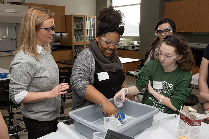 Melissa Krupp ’14, a teacher at Southern Regional High School and a Stockton MAIT graduate and adjunct instructor, leads a workshop to illustrate the solid and liquid properties of oobleck, a mixture of cornstarch and water, during Tween Tech in January 2017.