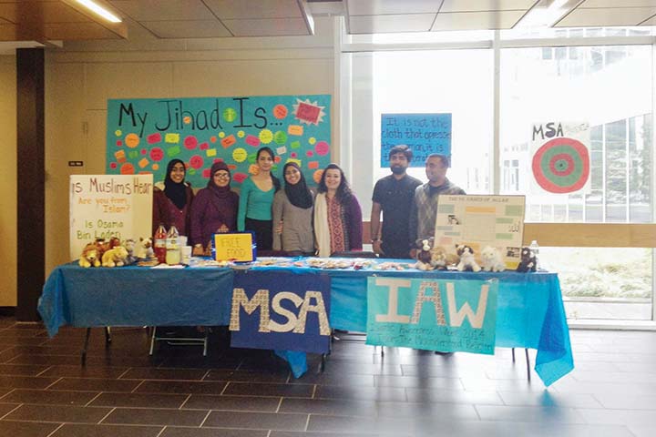 students in the Muslim Student Association tabling in the Academic Spine