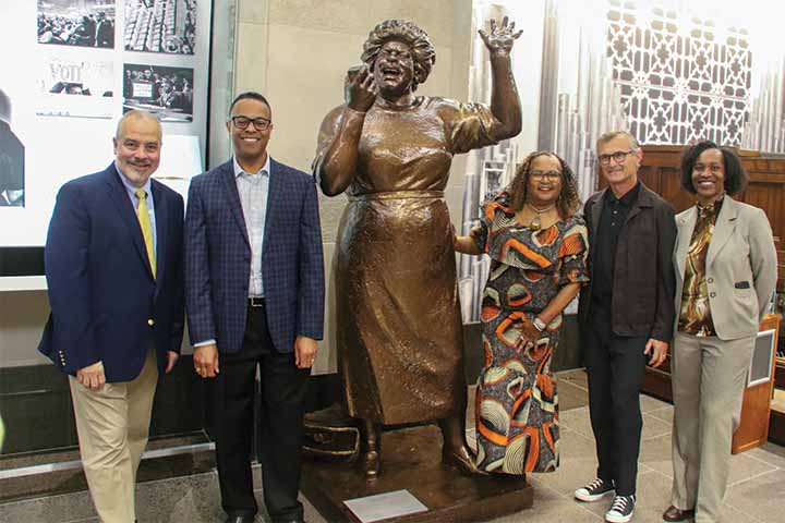 Members of the Stockton community pose with the statue of Fannie Lou Hamer