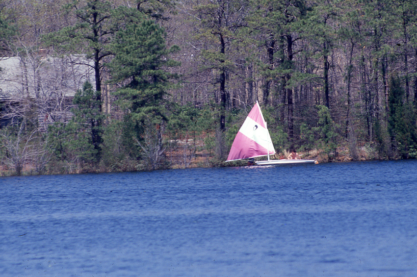 Sailing on Lake Fred. One of the north shore cabins is visible to the left.