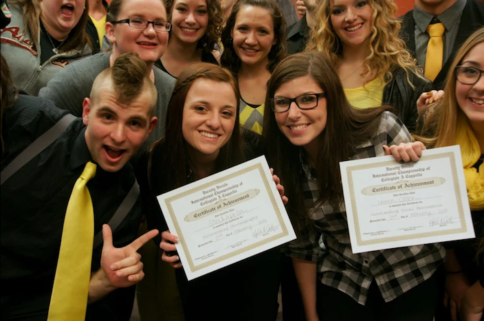 Stockapella shows off their Certificates of Achievement for Outstanding Choreography and Outstanding Vocal Percussion at ICCA 2013