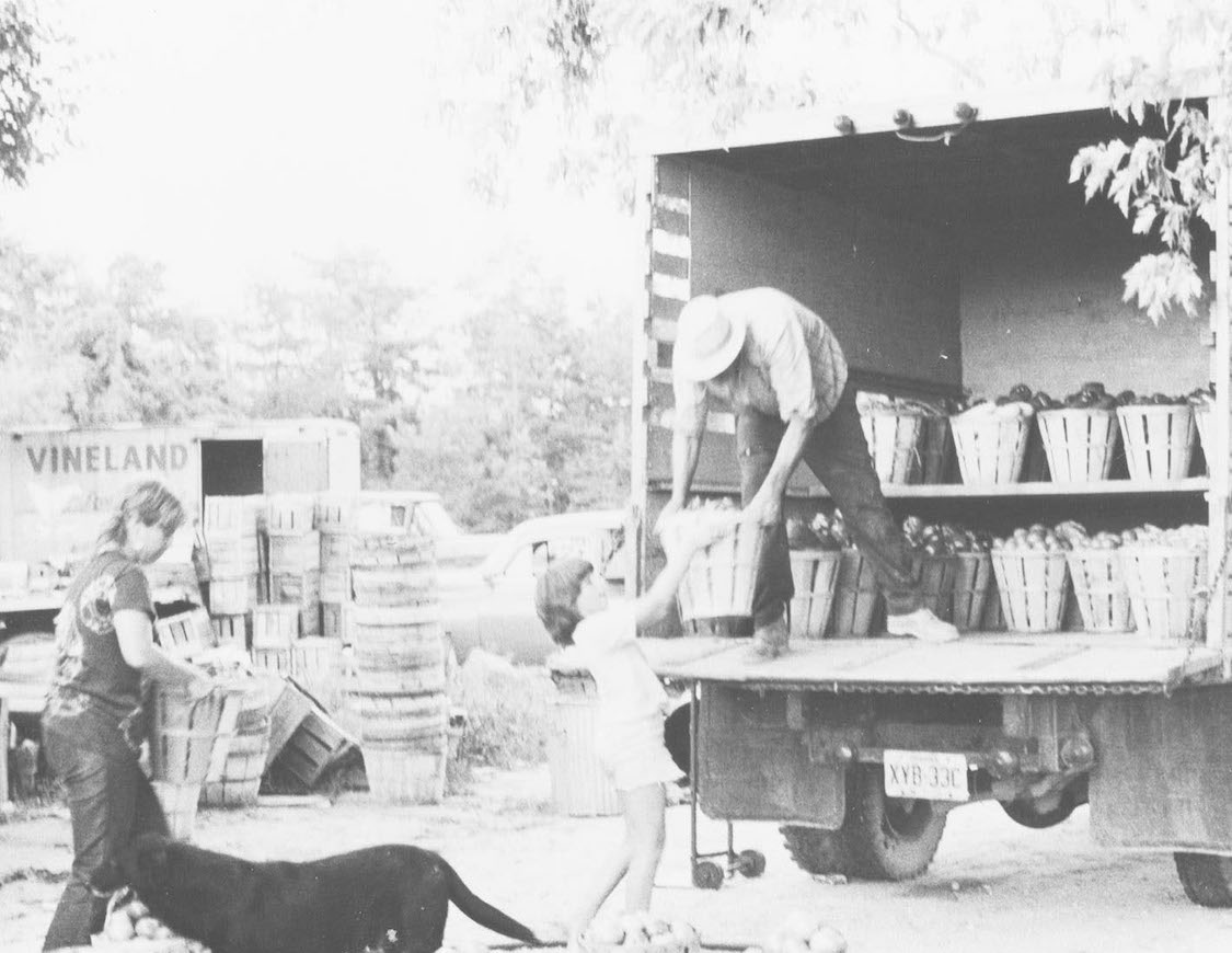 The Kennedys loading produce onto Leonard's truck.