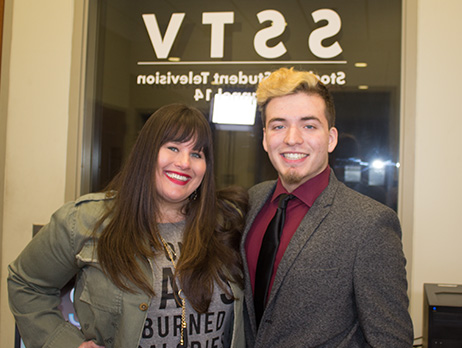 Student and Q102 media manager