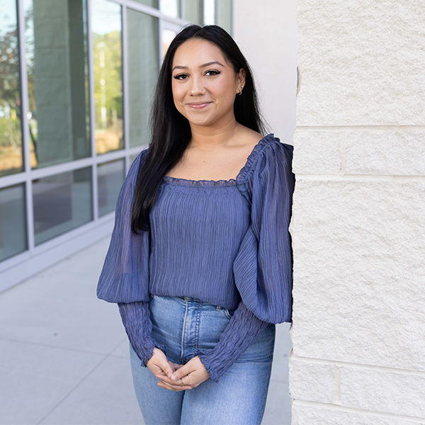 Yumara Hernandez, standing in front of the Campus Center